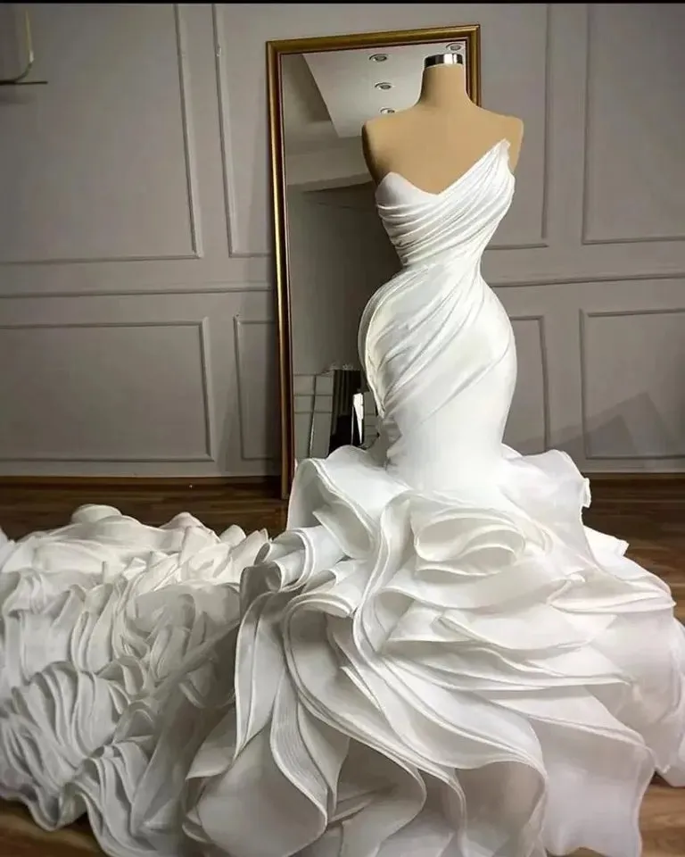 Ellegant Mermaid Wedding Gown. Ruffeled bridal gown with train.