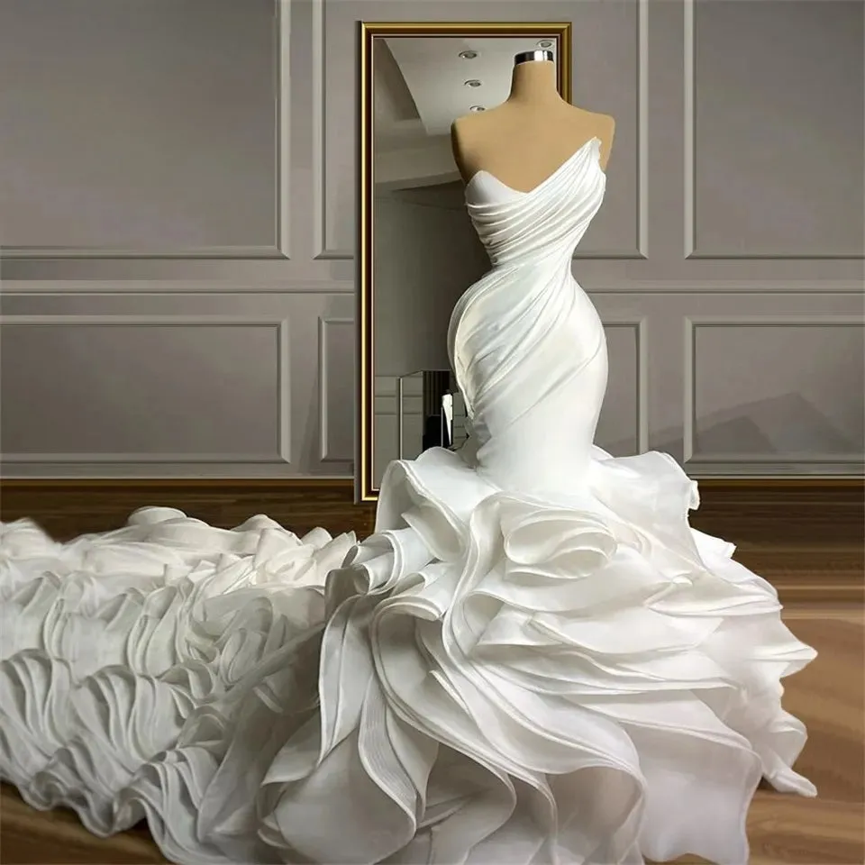 Ellegant Mermaid Wedding Gown. Ruffeled bridal gown with train.