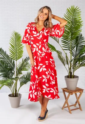 wrap dress in red with a leaf print design